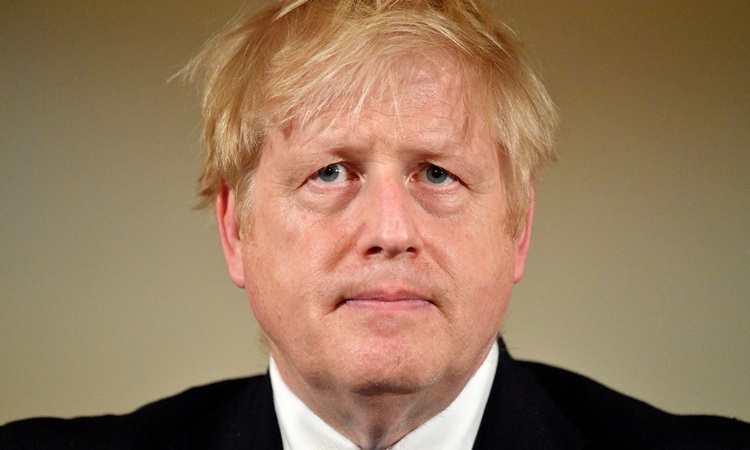 Ông Boris Johnson tại cuộc họp báo về Covid-19 ở Văn phòng Thủ tướng hôm 19/3. Ảnh: Reuters.